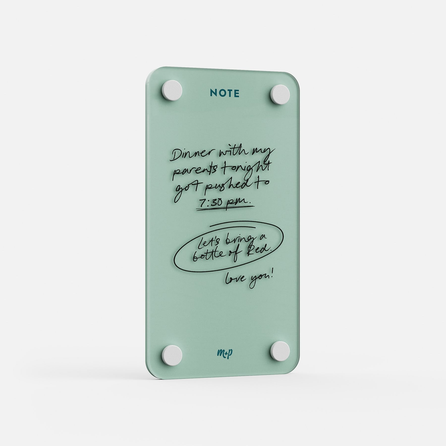 Angled view of a Seafoam green tall magnetic acrylic note board with a handwritten note to a partner